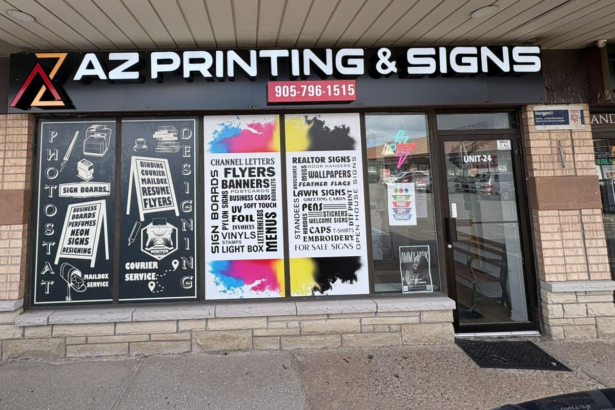 The AZ Printing & Signs storefront at 499 Ray Lawson Blvd, Brampton: the sign, the phone number and the window listings
