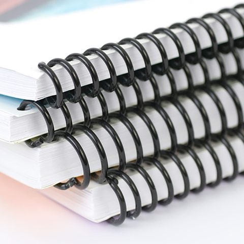 A stack of spiral-bound documents
